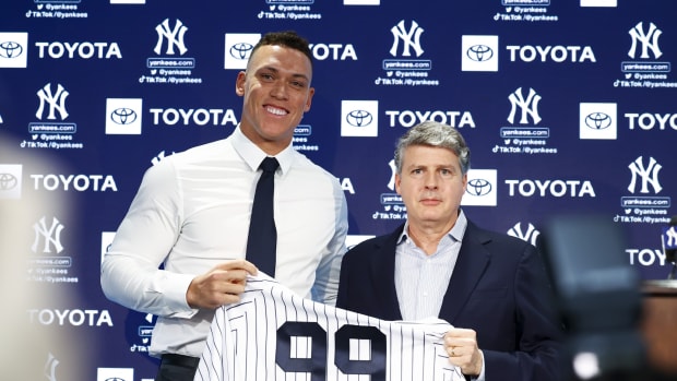 New York Yankees owner Hal Steinbrenner with outfielder Aaron Judge